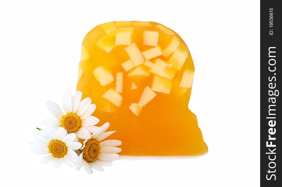 Yellow soap with camomiles over white