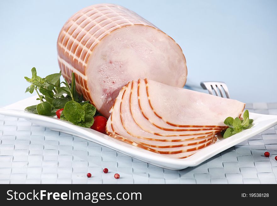 Tasty sliced ham with herbs