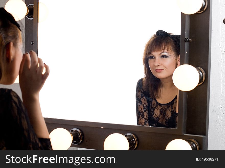 Cute gothic girl looking at herself