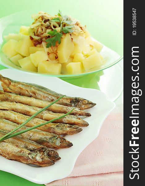Fried fish of smelts with the potato