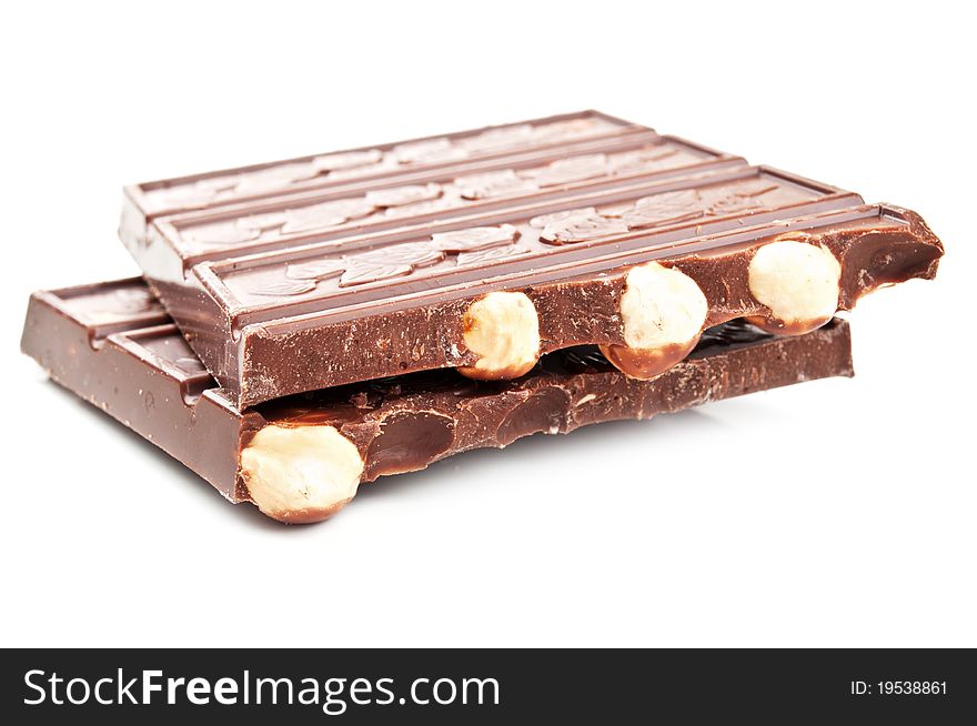 Bar of chocolate with nuts isolated on a white background