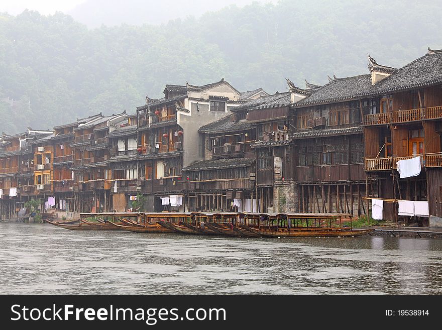 Boats And Wooden Houses At Fenghuang