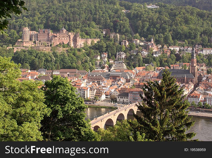 The scenery of Heilderberg dominated by the Heilderberg castle and Old Bridge seen from the viewpoint over the city, Germany. The scenery of Heilderberg dominated by the Heilderberg castle and Old Bridge seen from the viewpoint over the city, Germany.