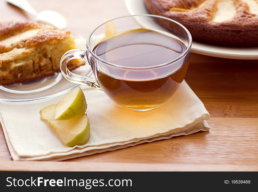 Tea cup with apple pie on table. Tea cup with apple pie on table