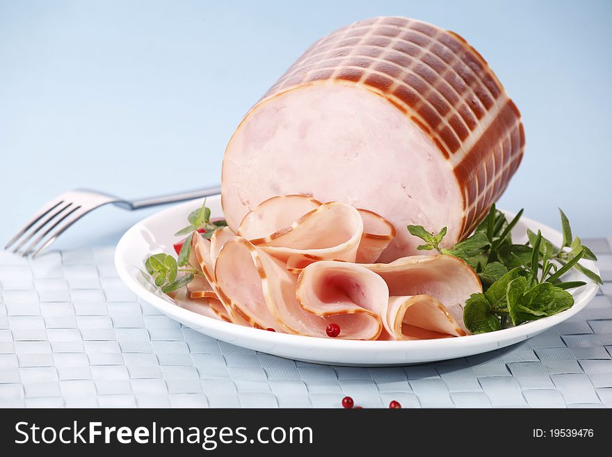 Tasty sliced ham with herbs