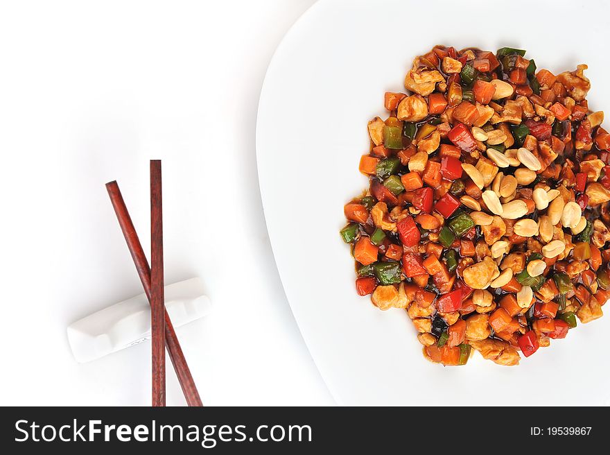 Steamed vegetables and meat with peanut on plate. Chinese cuisine.