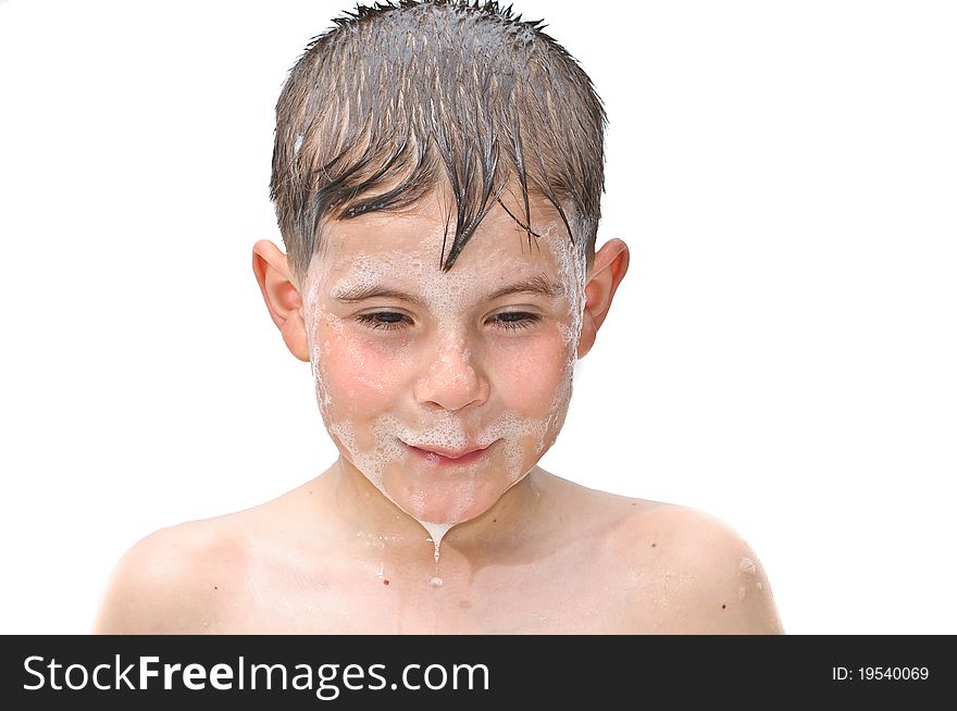 A boy swims in the bathtub. Isolated on white background picture