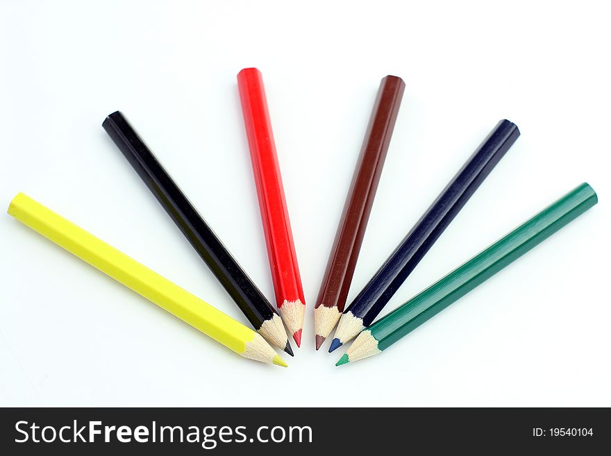 Kids color pencils on a white background
