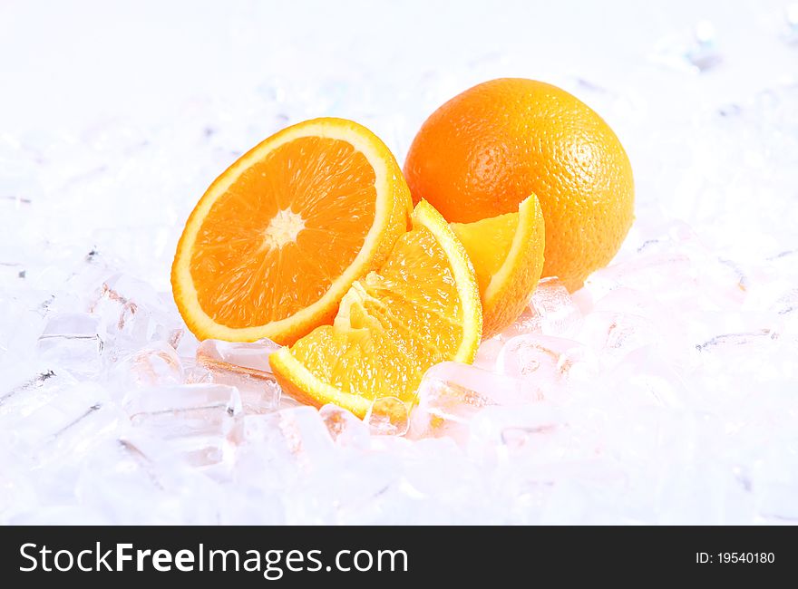 Fresh oranges in ice, close up view. Fresh oranges in ice, close up view