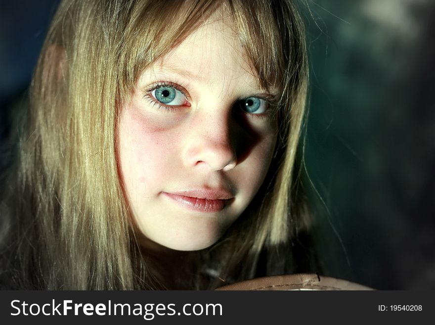 Close-up portrait beauty sad young girl looking at the camera