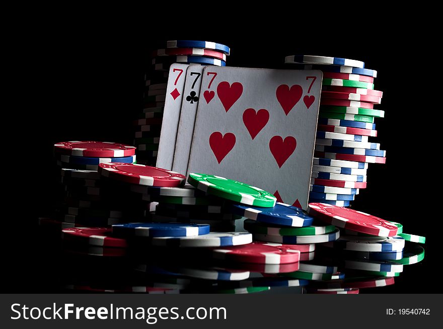 Success in poker and chips isolated on a black background