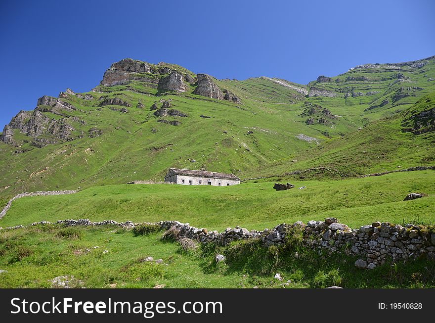 Panoramic view of the mountains of Lunada in Cantabria, with typical cabins and parcels. Panoramic view of the mountains of Lunada in Cantabria, with typical cabins and parcels
