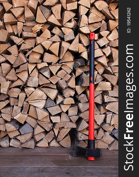 Axe with firewood background