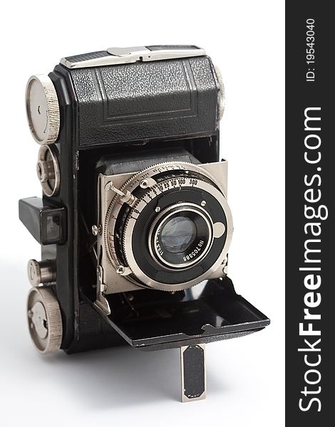A vintage folding camera of German make.
