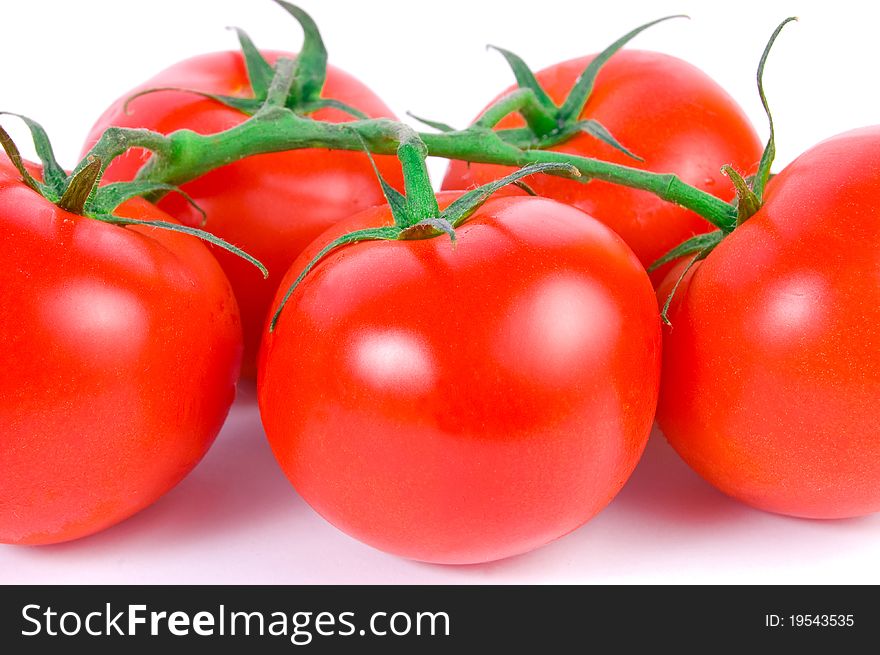 Close-up shot of red appetizing tomatoes on white background