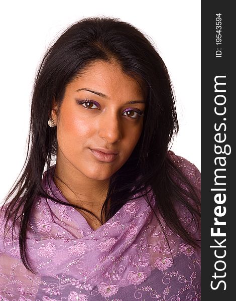 An asian woman wearing a purple pashmina scarf isolated on a white background.