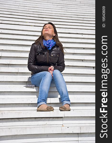 Woman sitting on the marble steps