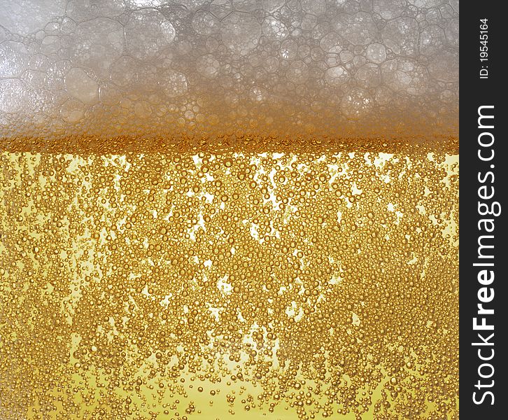 Light beer bubbling with froth. Light beer bubbling with froth
