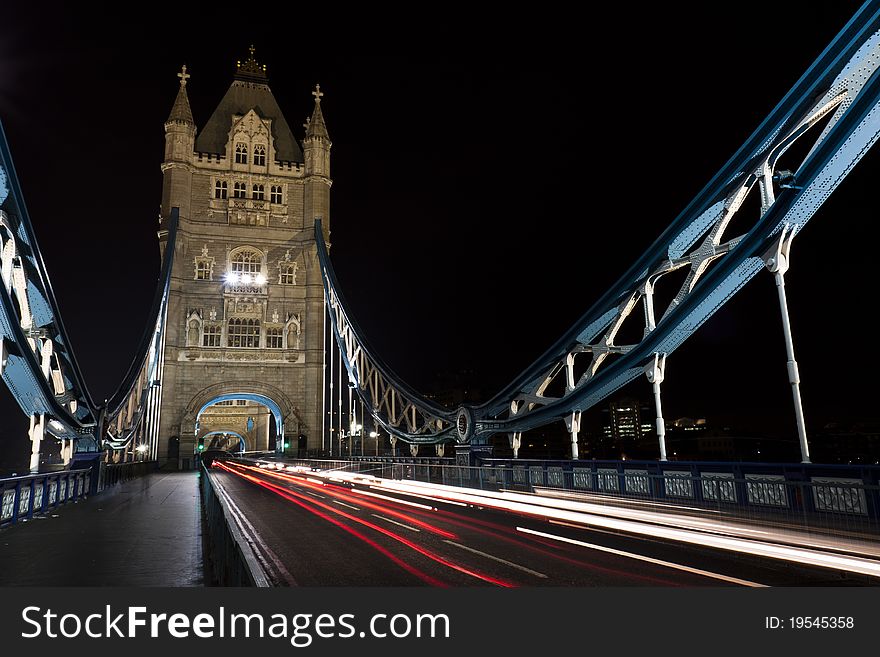 Tower Bridge at night with traffic streaks. Tower Bridge at night with traffic streaks