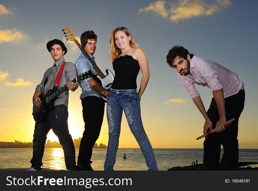 Young Musical Band Posing Outdoors With Attitude