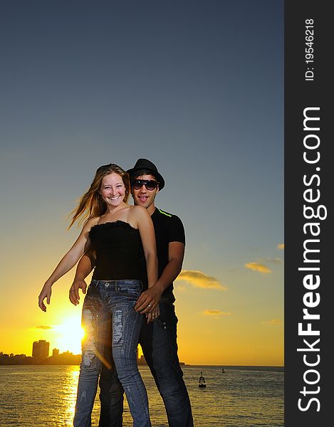 Joyful hispanic couple at sunset