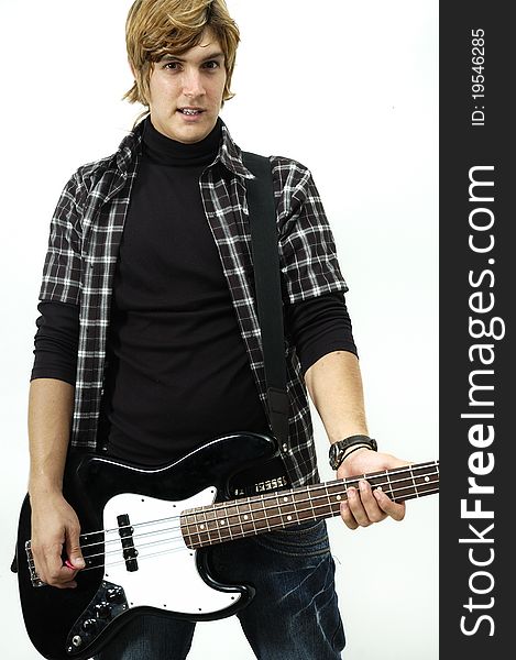 Portrait of young male posing with electric bass guitar - isolated on white. Portrait of young male posing with electric bass guitar - isolated on white