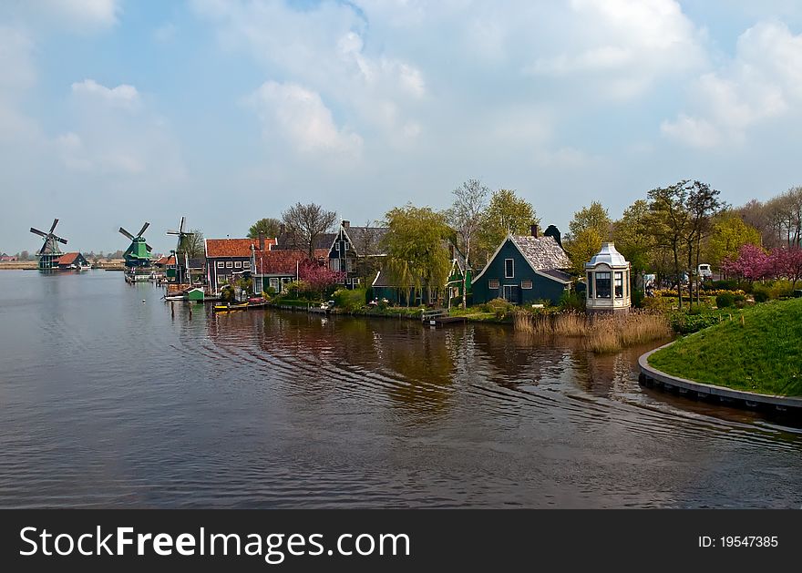 Windmill landscape in the Netherlands . Windmill landscape in the Netherlands .