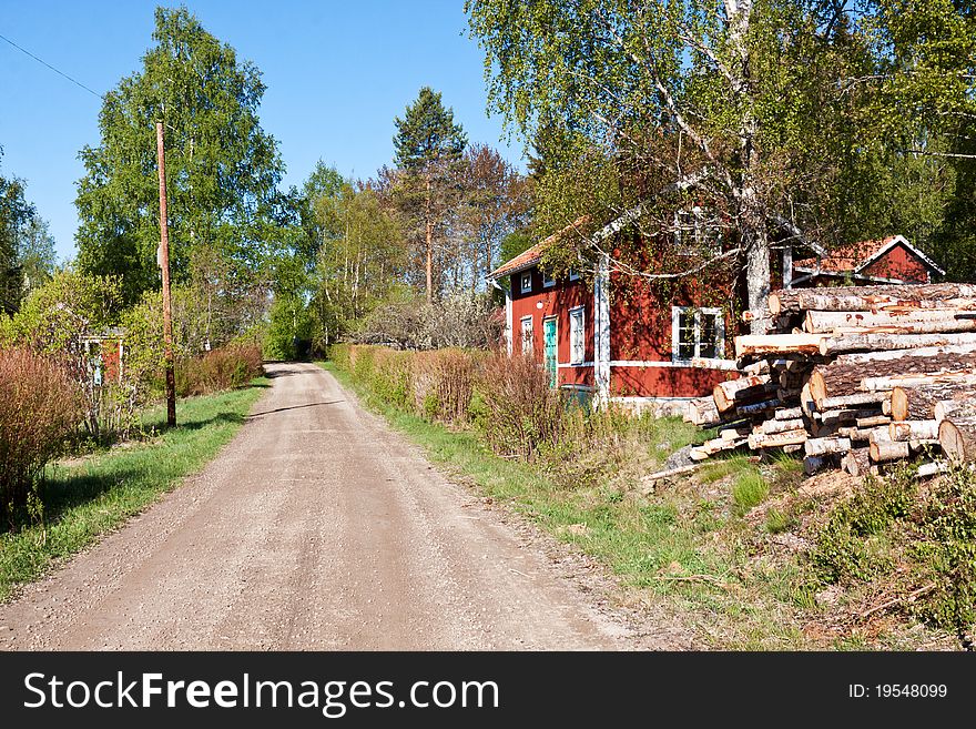 A rural road through a little village in Sweden. A rural road through a little village in Sweden