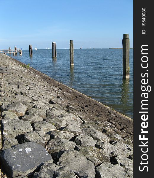 Pier going out into the water, view of the ocean. Pier going out into the water, view of the ocean.