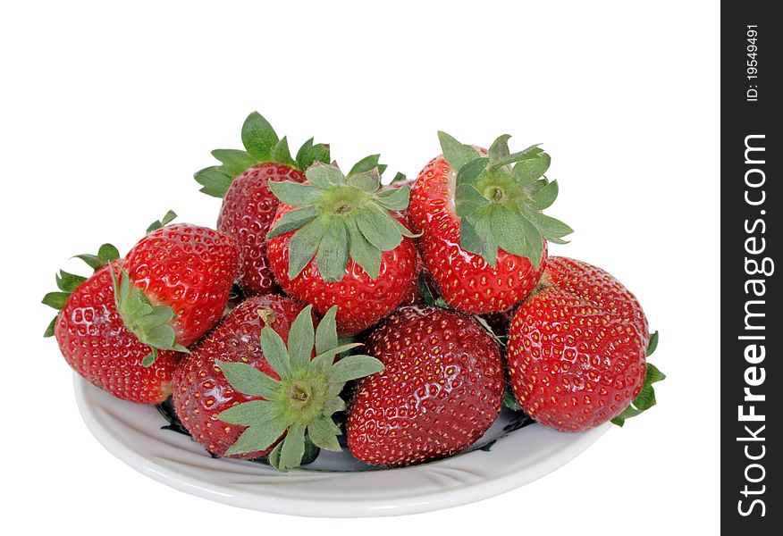 Fresh strawberry on plate isolated over white background