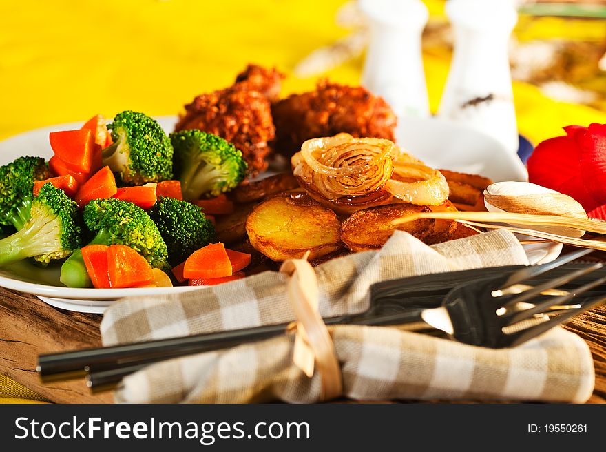 Fried potatoes broccoli carrots and roasted chicken. Fried potatoes broccoli carrots and roasted chicken