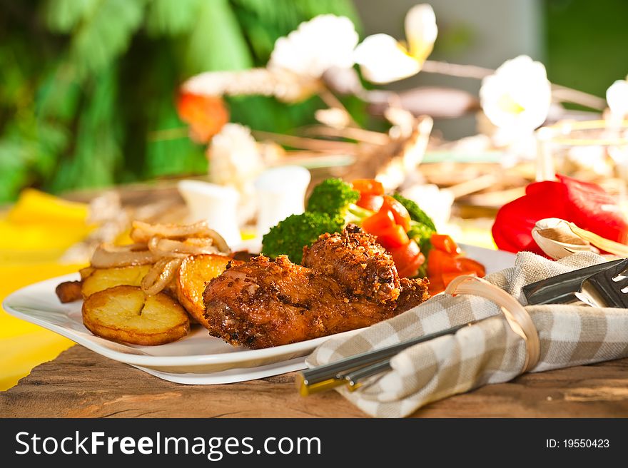 Fried potatoes with vegetables and chicken