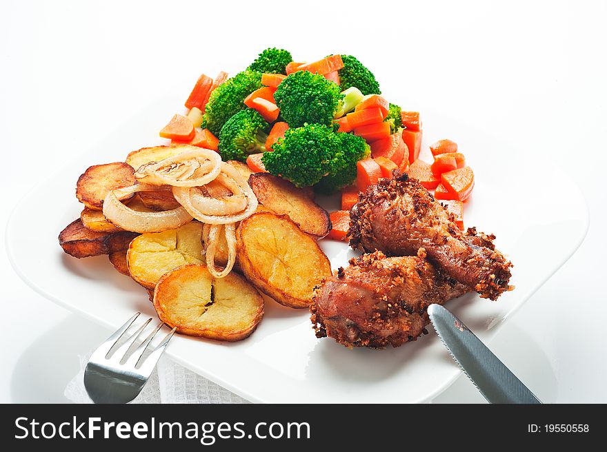 Fried potatoes with vegetables and chicken