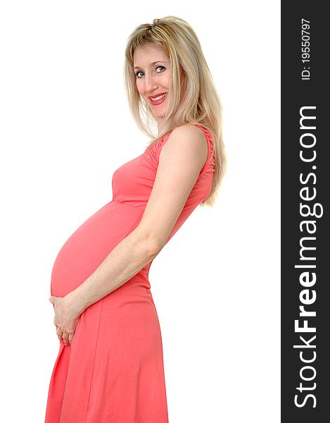 Pregnant woman in pink smiles. Pregnant woman in pink smiles