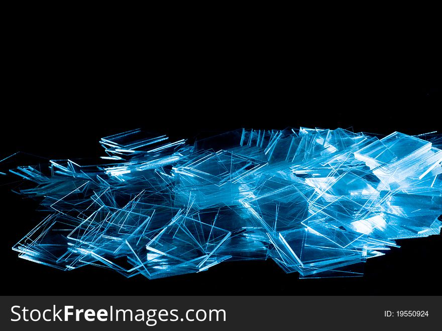 Spilled thin glass isolated on black