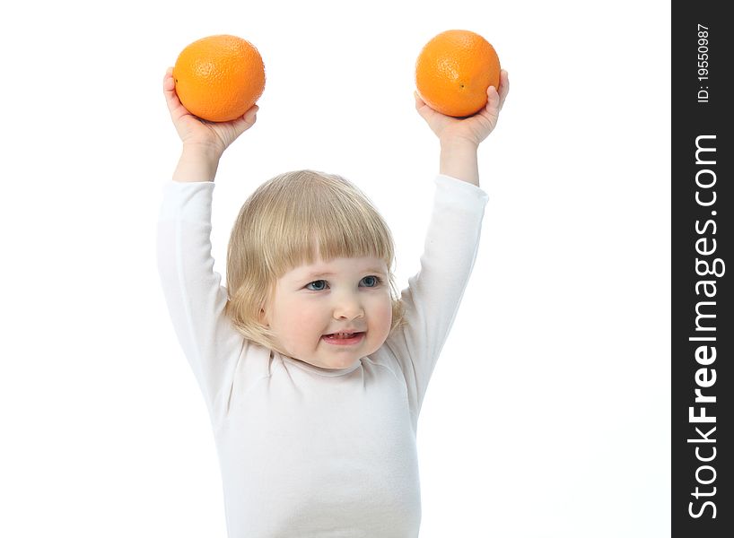 Baby with oranges isolated on white