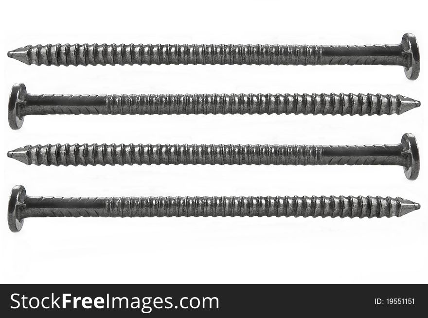 Four steel nails arranged horizontally and over white. Four steel nails arranged horizontally and over white