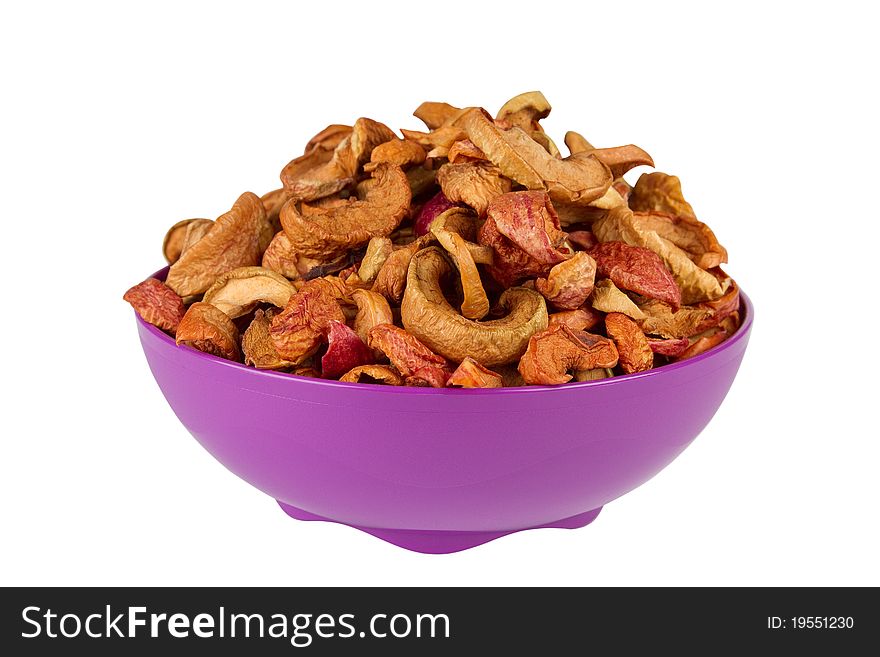 Organic dried apples in bowl, isolated on white background.group of dry slices of apple in bowl.