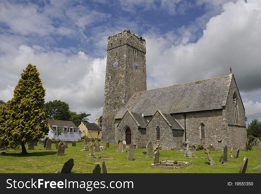 Medieval Lamphey church in the Pembrokeshire area of Wales is surrounded by its okd church-yard. It's a typical example of the religious architecture of the area.