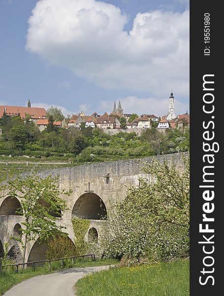 The ancient town of Rothenburg ob der Tauber in the federal state of Bavaria in Germany seen from the valley floor. Rothenburg is very popular with tourists from all over the world. The ancient town of Rothenburg ob der Tauber in the federal state of Bavaria in Germany seen from the valley floor. Rothenburg is very popular with tourists from all over the world.