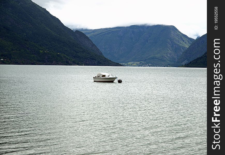 Small boat on the calm waters of Lake. Small boat on the calm waters of Lake