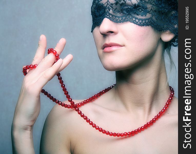 Beautyful woman in veil with red necklace. Beautyful woman in veil with red necklace