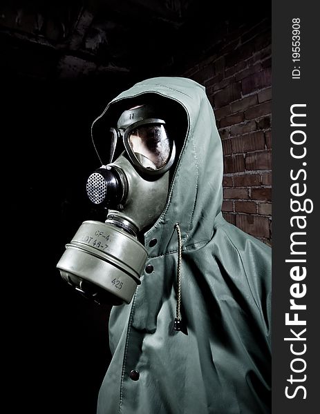 Bizarre portrait of man in gas mask