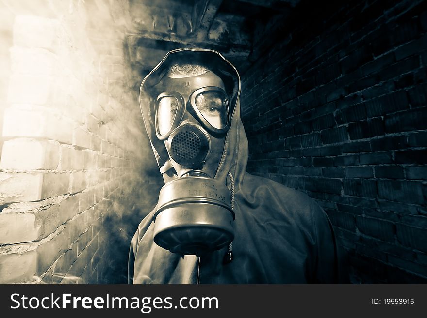 Bizarre portrait of man in gas mask