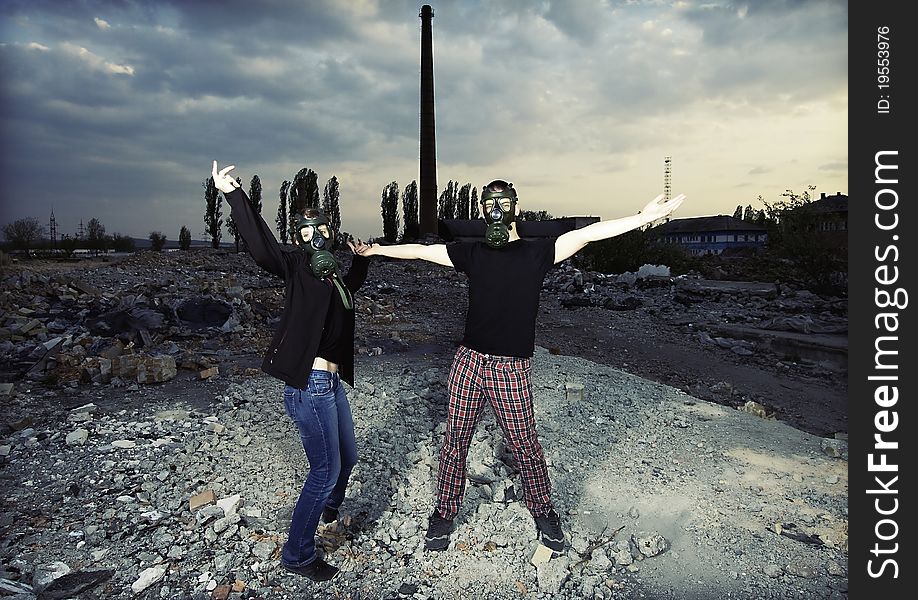 Bizarre portrait of romantic couple with gas masks