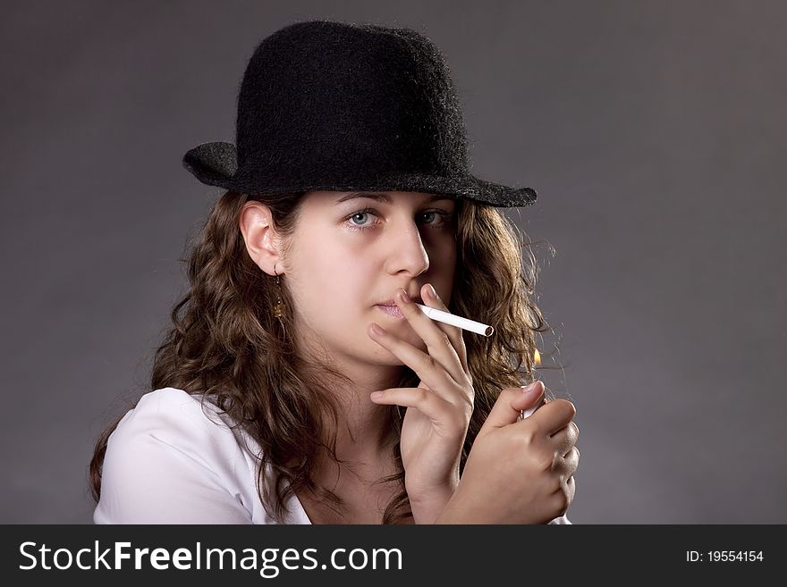 A Vintage Woman Smoking A Cigarette