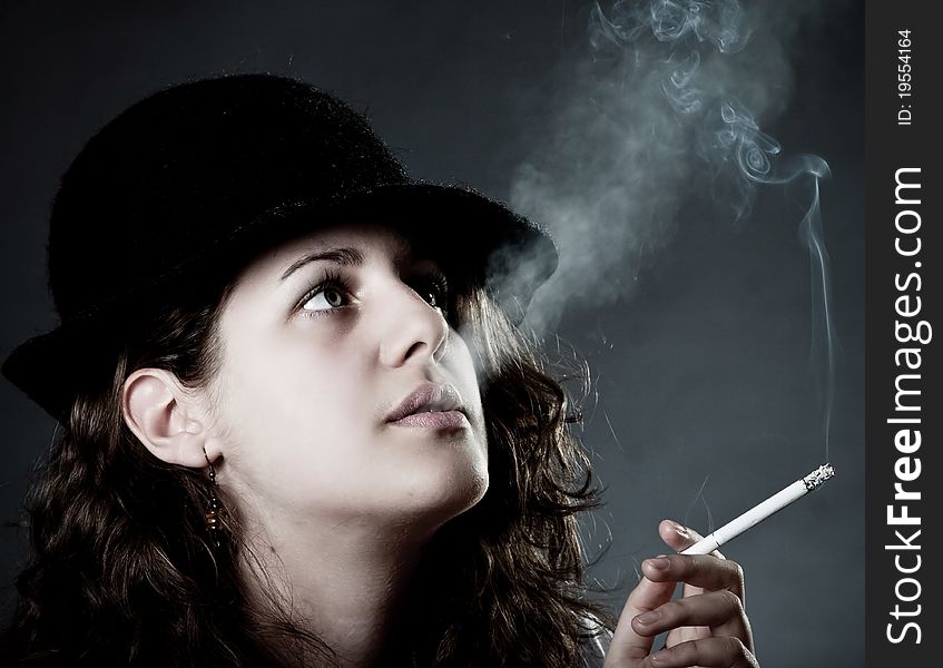 A Vintage Woman Smoking A Cigarette