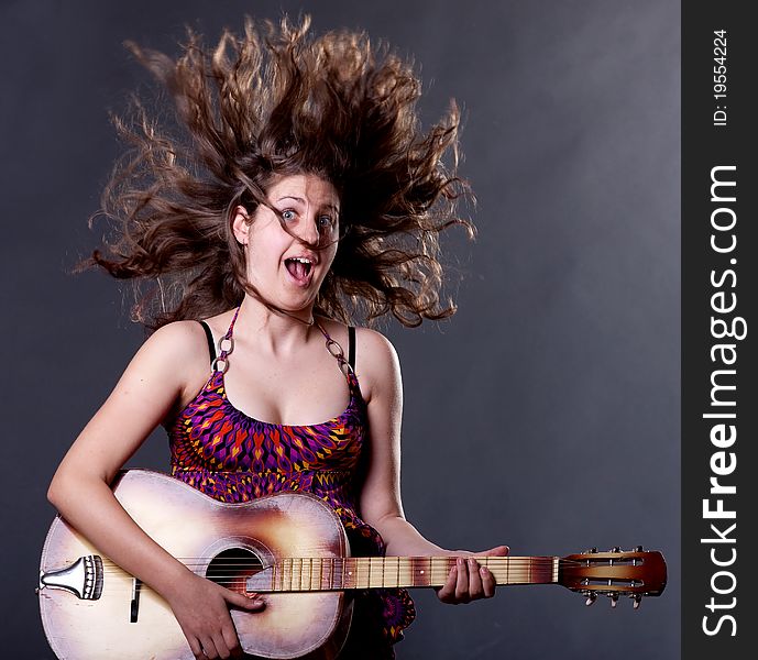 Young girl playing guitar