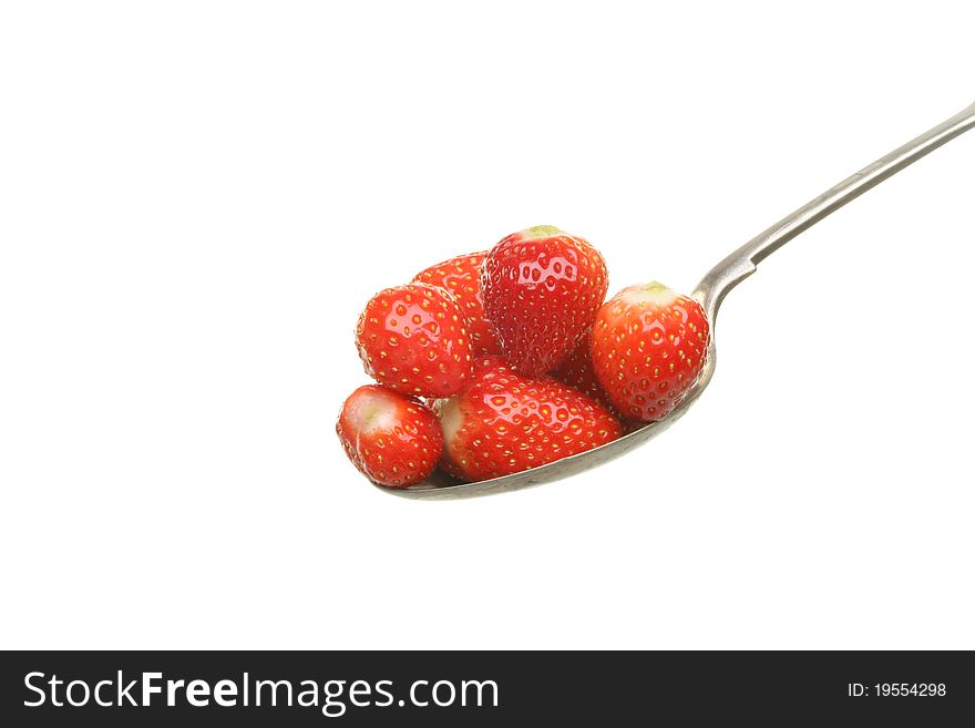 Fresh ripe strawberries in a spoon isolated against white. Fresh ripe strawberries in a spoon isolated against white