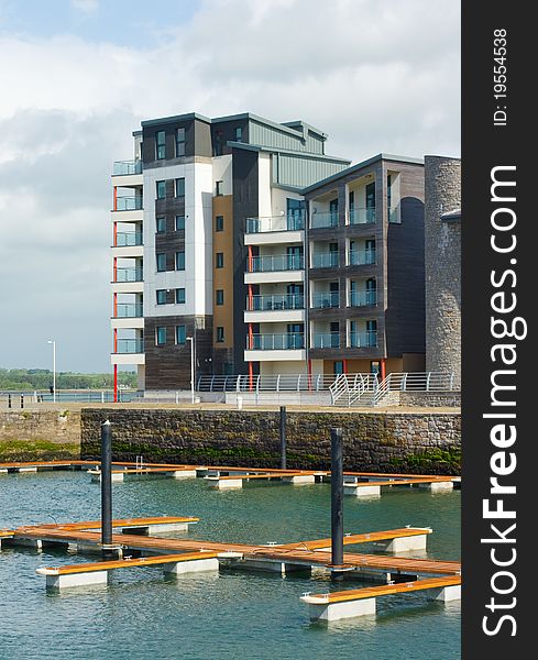 Caernarfon marina with the newly built water front development behind. Caernarfon marina with the newly built water front development behind.